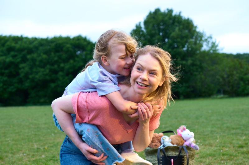 Woman wit child on her back