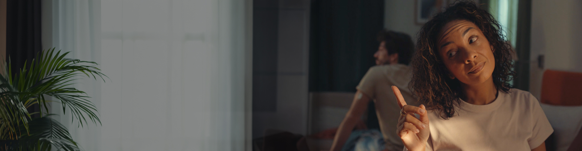 Lady pointing at man in mirror